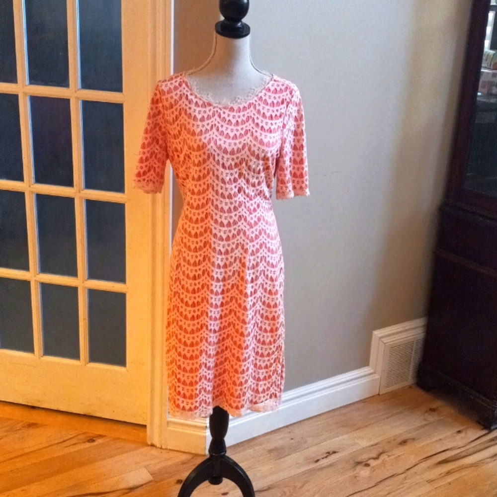 Large, orange and white lace knee length, short sleeved dress